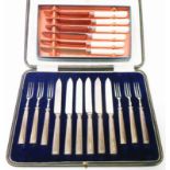 A cased set of six each silver plated fruit knives and forks with silver handles - sold with a boxed