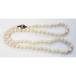 A boxed single strung cultured pearl necklace