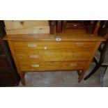 A 36" vintage polished oak chest of three long graduated drawers, set on a bobbin turned open