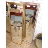 Two modern framed oblong wall mirrors