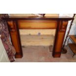 A 4' 6" 20th Century stained mixed wood fire surround with flanking acanthus scroll capitals