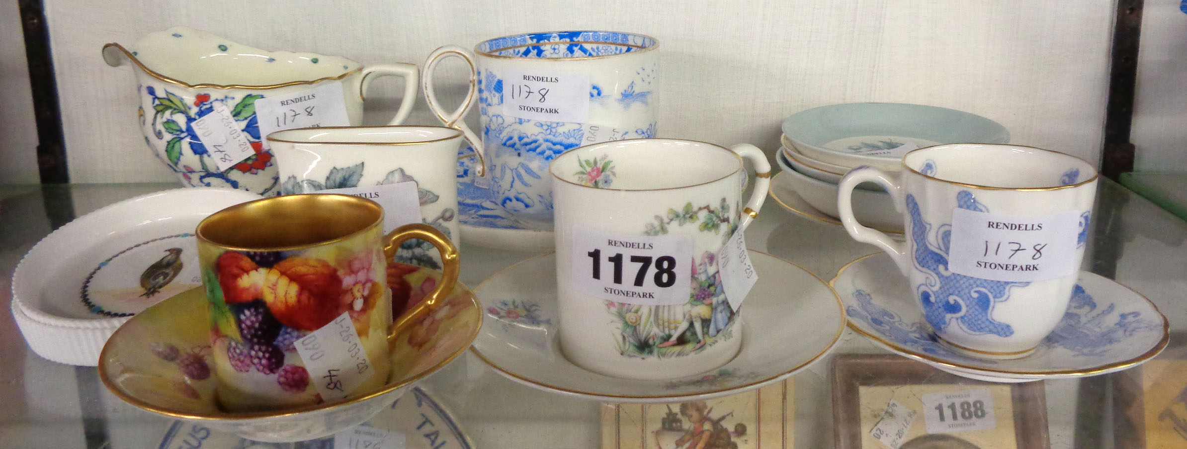 A Royal Worcester hand painted demitasse coffee can and saucer decorated with blackberries, signed