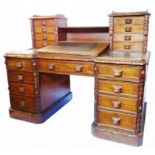 A 5' old polished oak twin pedestal desk with eight flanking bracket locking drawers and shelf to