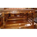 A 36 1/2" polished oak coffee table with moulded decoration to frieze, set on turned supports and