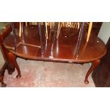 A late Victorian mahogany extending dining table with single leaf, set on heavy cabriole legs with