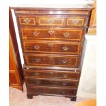 A 3' 5" 19th Century mahogany and strung chest on chest with moulded canted top and corners, three