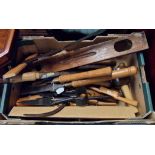 A box of tools including wood turning skew chisel, gouges, sharpeners, lignum vitae mallet, large