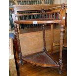 An Edwardian stained oak corner umbrella stand with spindle back and turned supports - drip tray
