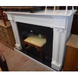 A 4' 10" modern white painted MDF and granite effect laminate fireplace surround with flanking