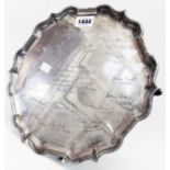 A 12" diameter silver salver with shaped cast rim and extensive presentation text and signatures