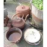 A large cast iron kettle, an oval hanging saucepan with lid and another pot - sold with two iron and