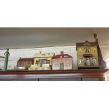Four vintage wooden dolls houses of varying styles and manufacture - sold with a wooden doll and a