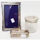 A small silver fronted photograph frame - sold with two silver topped dressing table jars