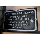 A modern painted cast iron No Trespassing sign