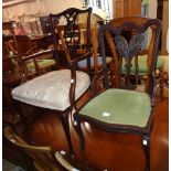 An early 20th Century stained walnut framed elbow chair with decorative pierced splat and
