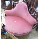 A 3' 3" Edwardian camel back boudoir corner chair upholstered in old rose velour, set turned and