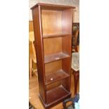 A pair of 14 3/4" reproduction mahogany four shelf open bookcases with plinth bases