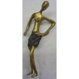 An abstract bronze statue of a woman