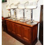 A 6' 4" stained oak and mahogany bar unit with thick solid oak top, panelled front and sides, on