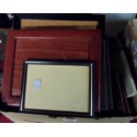 A box containing a quantity of leather and other photograph frames