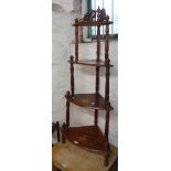 An inlaid walnut four tier whatnot with turned supports - sold with a reproduction stained wood