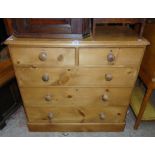 A 3' 3" Victorian waxed pine chest of two short and three long graduated drawers, set on plinth