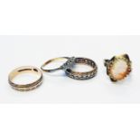 Four assorted gold rings comprising an 18ct five stone diamond, 375 cameo panel, wedding band and