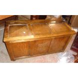 A 38" stained oak locker top box with carved shield decoration to the front