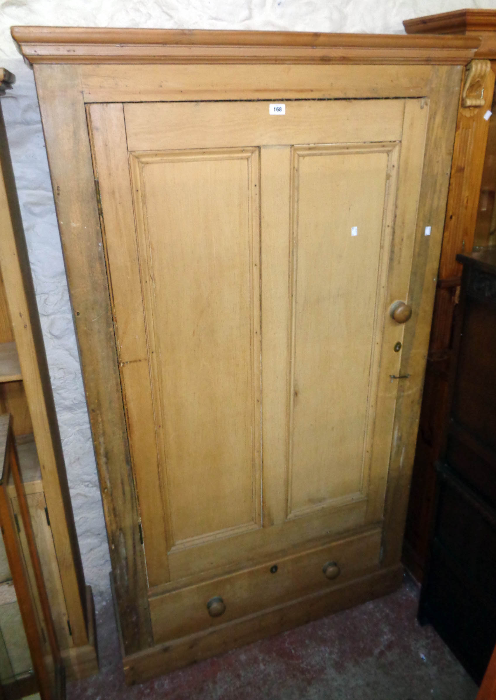 A 3' 7" Victorian pine wardrobe with later moulding to top, hanging space enclosed by a panelled