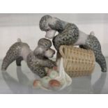 A vintage Lladro figure group entitled Two Poodles Playing in an Apple Basket - retired
