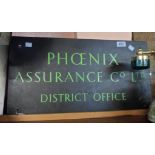 A bronze company wall sign for Phoenix Assurance Co., Ltd. District Office in green enamel