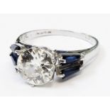 A marked PT (platinum) Art Deco style ring, set with 1.91ct. brilliant cut diamond and four baguette