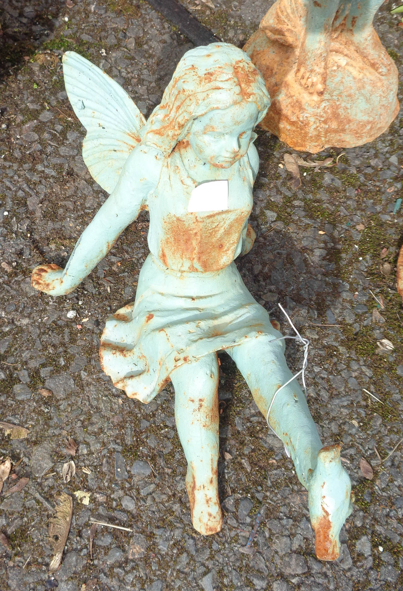 A iron seated garden angel