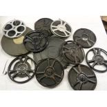 A collection of vintage film reels including Popeye's Slippery Work (1937), Mickey Mouse, etc.