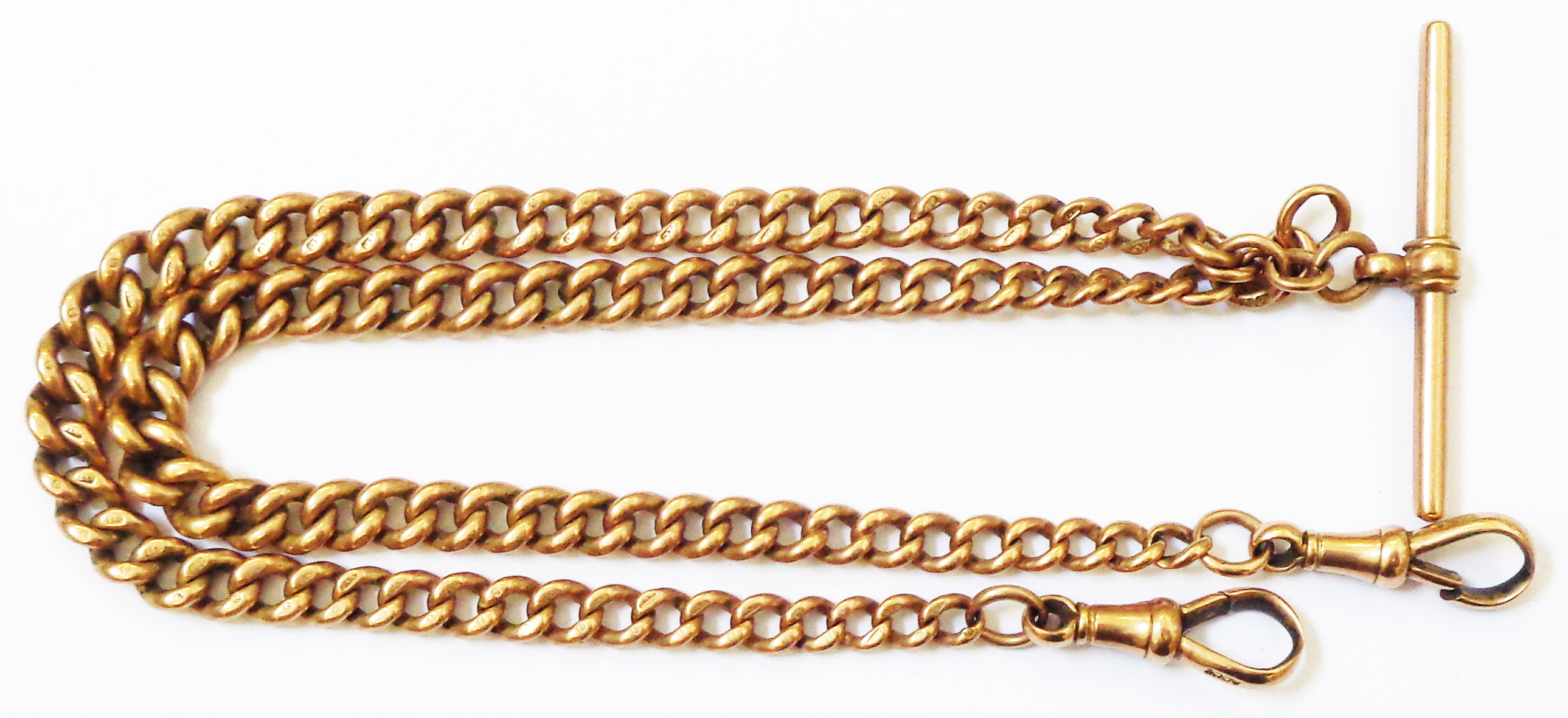 A hallmarked 9/375 rose gold double Albert watch chain with graduated links, two lobster clasps