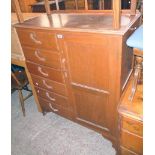 A 3' 3 1/2" vintage stained mixed wood bedroom storage unit with flight of six drawers and