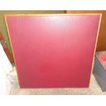 A vintage Vono floding card table, with red rexine top