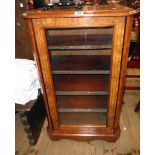 A 21 3/4" Victorian figured walnut cross banded and strung music cabinet with canted corners and