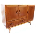 A 3' 7" Ercol light elm sideboard with three cupboard doors and single long drawer under all with
