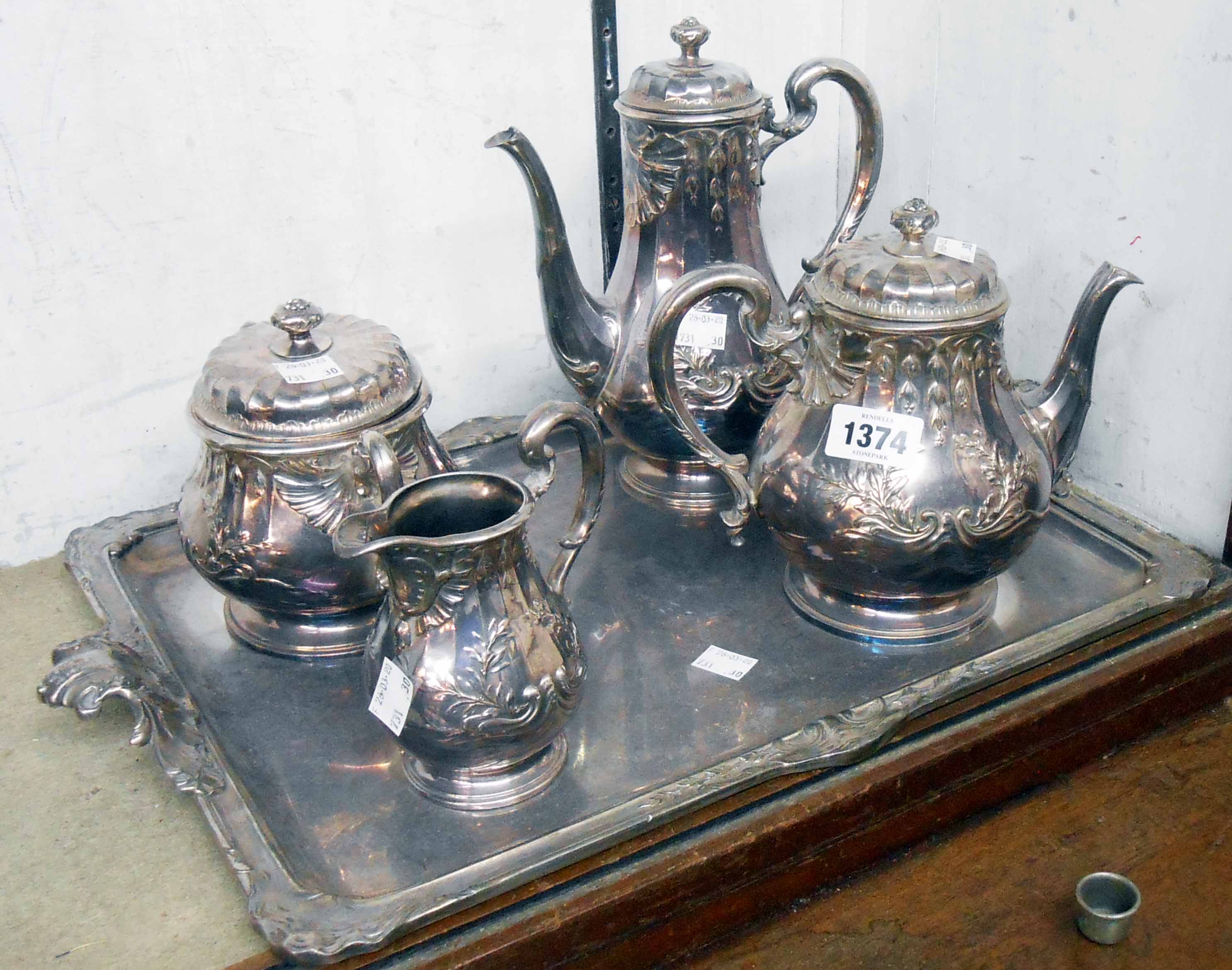 An early 20th Century French four piece silver plated tea and coffee set, on tray with flanking