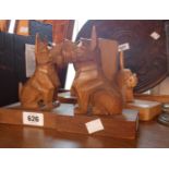 A pair of wooden bookends depicting terriers with glass eyes - sold with a similar pair depicting