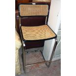 An Italian chrome plated framed bar stool with stained wood and rattan back and seat panels