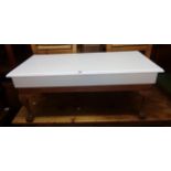 A 36 1/2" coffee table with painted top, set on cabriole legs with claw and ball feet