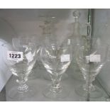 A decanter, claret jug and seven assorted glasses