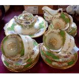 A Coalport Panel Apple Green pattern six place tea set, comprising six trios, bread plate, milk