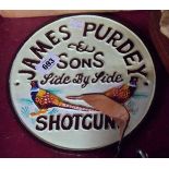 A reproduction cast-iron James Purdy & Sons Shotgun sign