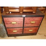 A 24" stained pine freestanding table chest of four deep short drawers, set on bracket ends