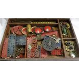 A quantity of vintage Meccano in a wooden box including motor, pulley wheels, etc.