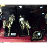 A pair of brass horse pattern bookends - sold with a quantity of horse brasses