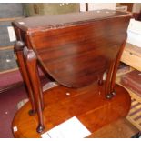 A 29 1/2" early 20th Century stained walnut Sutherland table, set on cabriole legs with pad feet